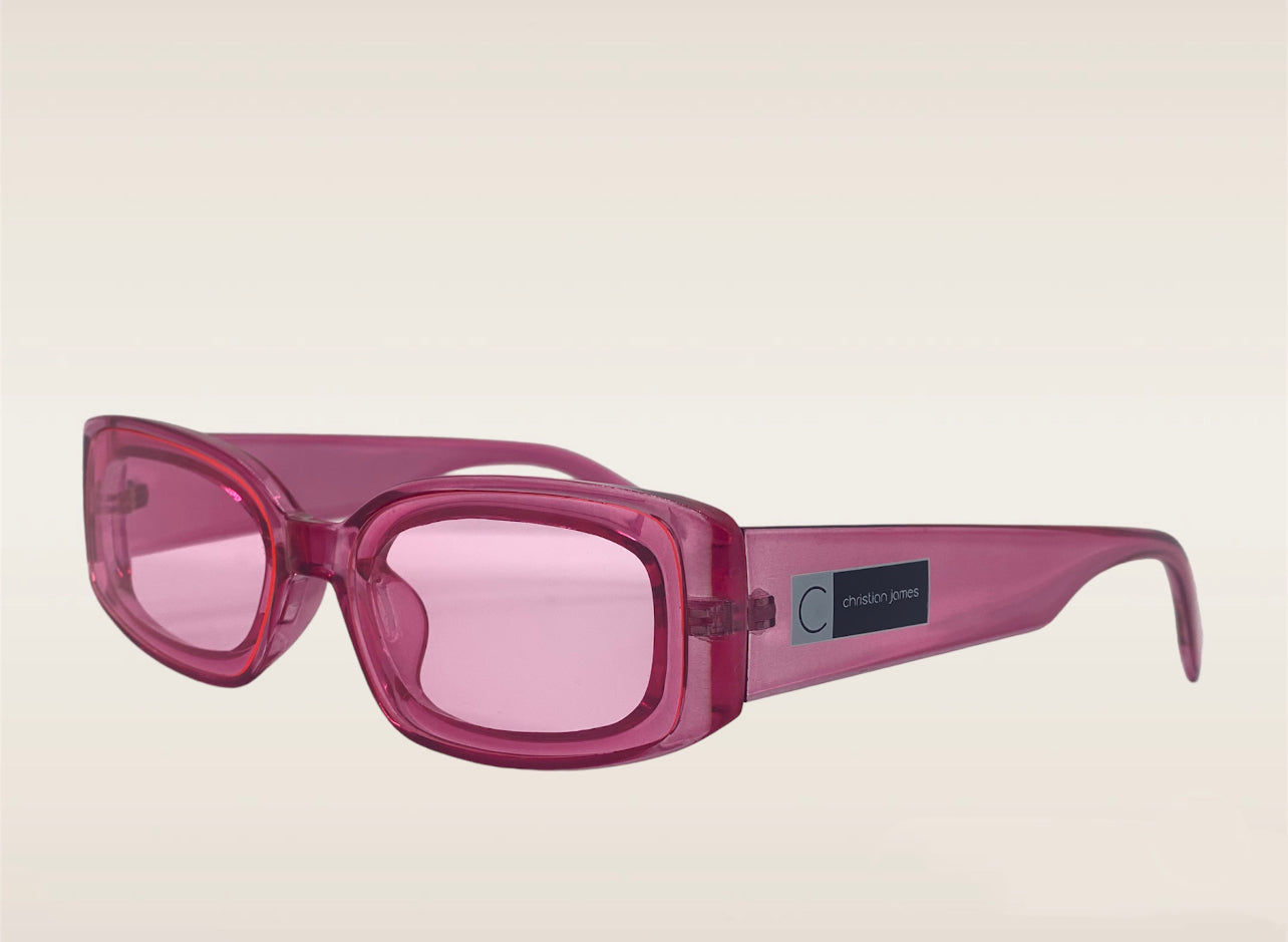 Pink frames with a Christian James logo on the side and UV 400 ac lens.