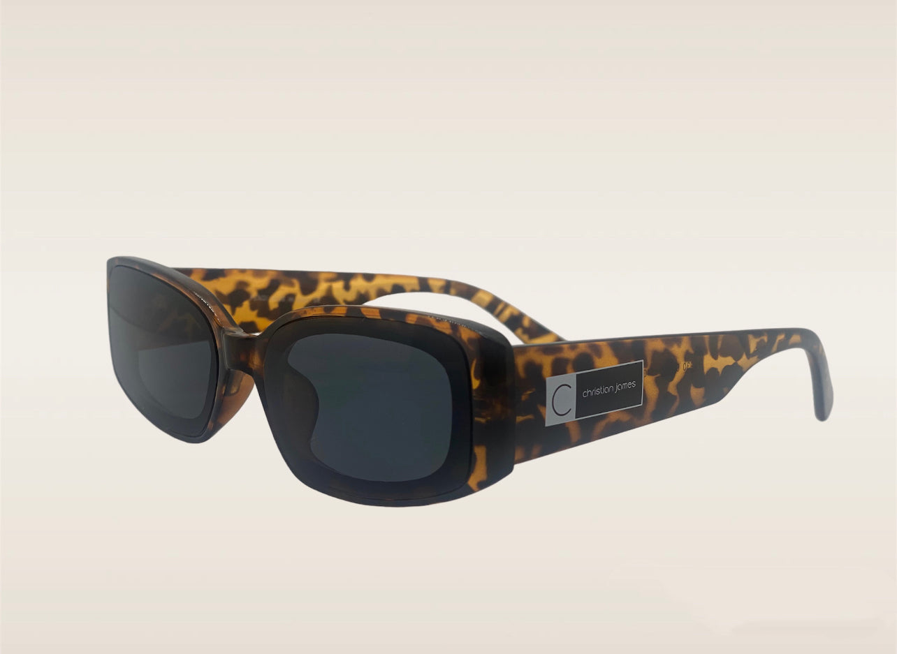 Leopard frames with a Christian James logo on the side and UV 400 ac lens.