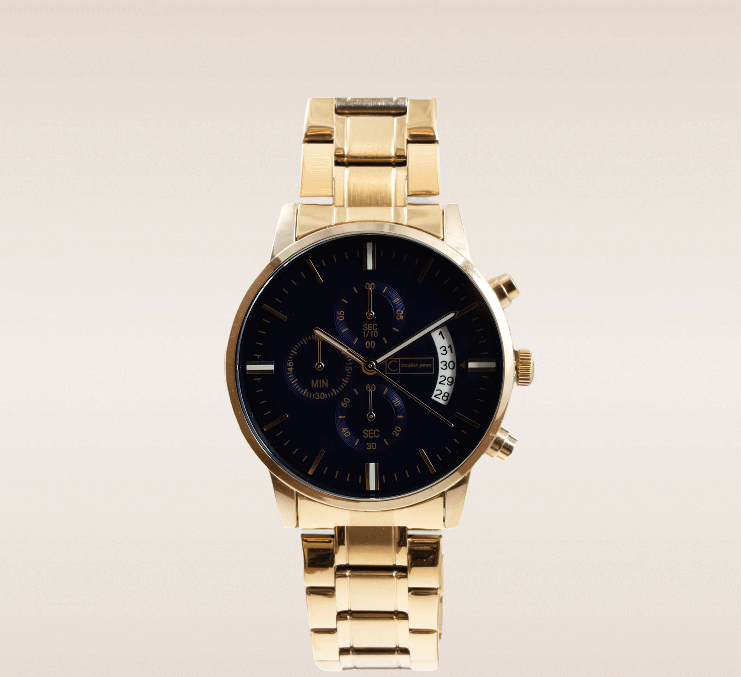 In this up-close shot, we are presented with the captivating Varsity Timepiece, a symbol of elegance and precision. The watch features a stunning gold link bracelet that wraps around the wrist, exuding a sense of luxury and sophistication. The deep blue watch face provides a striking contrast against the gold, creating a bold and timeless aesthetic. The face is carefully designed with clear and legible markers, allowing for easy time reading. The sleek golden watch hands glide effortlessly across the face, marking the passage of time with grace. 