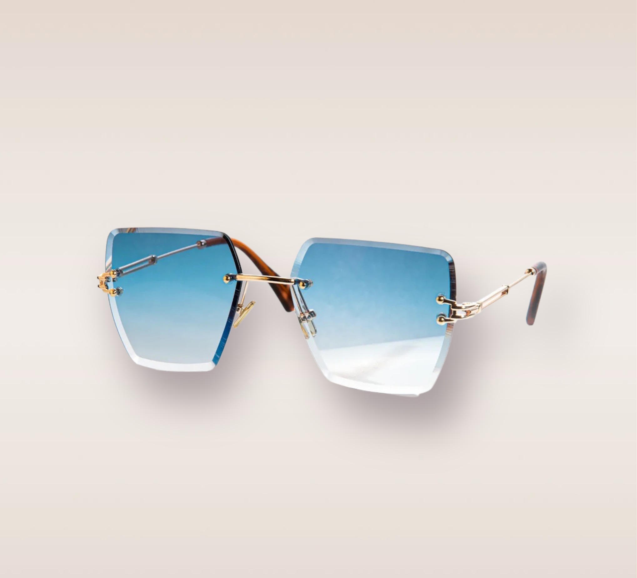 In this up-close shot, we are introduced to the captivating Nipsey Blue frames, a stylish and sophisticated eyewear option. The rimless frames feature a mesmerizing ocean gradient blue hue, evoking a sense of tranquility and depth. The gold arms add a touch of opulence and refinement, complimenting the blue tones with a warm metallic accent. These frames are a true fashion statement, combining modern design with a touch of luxury. 