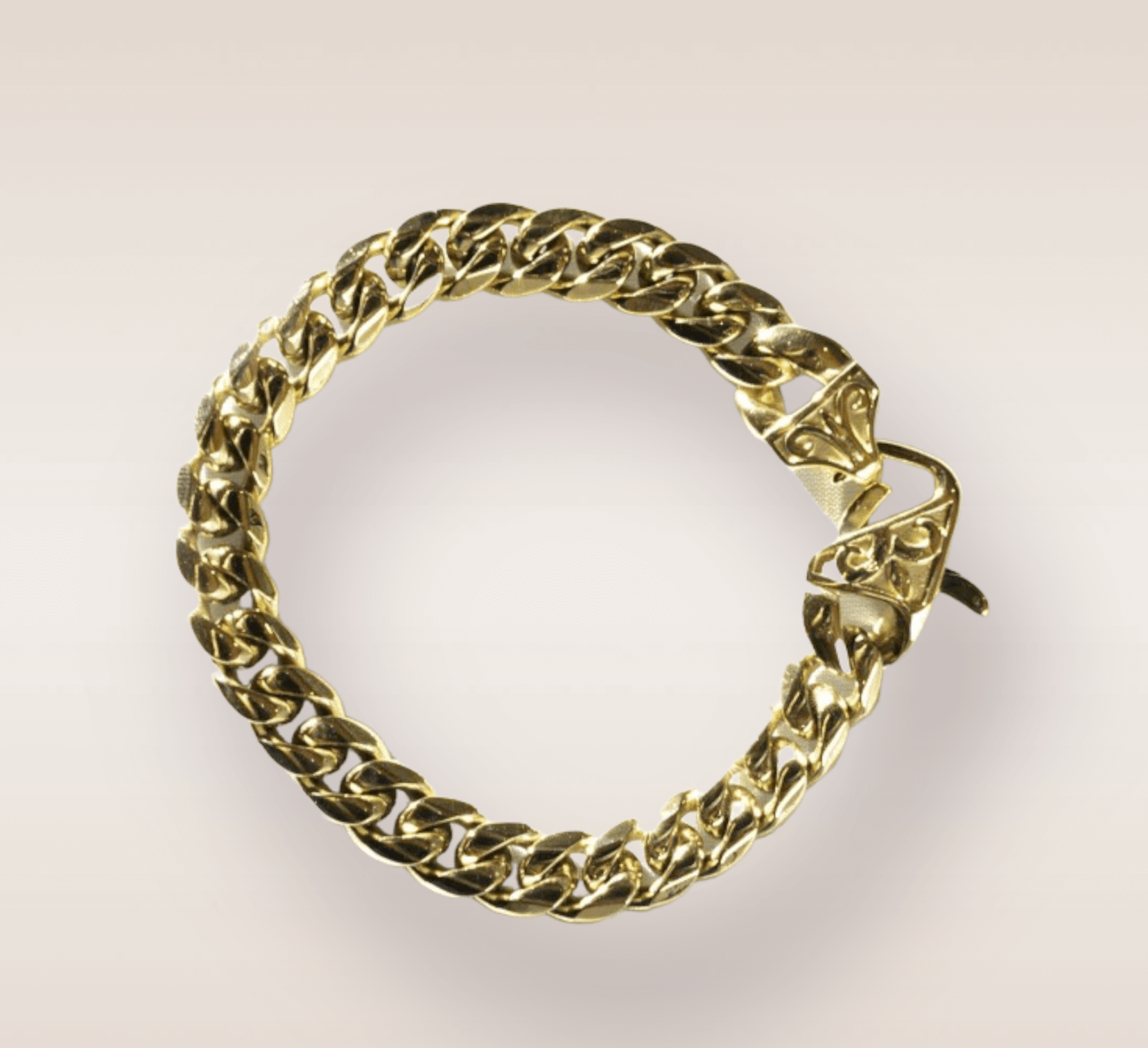 In this close-up shot, is the Sneaky Gold Link, a mesmerizing piece of jewelry that radiates opulence and allure. The golden cuban link captures the viewer's attention with its intricate and interlocking design.The gold hue exudes warmth and richness, elevating the overall aesthetic of the piece.