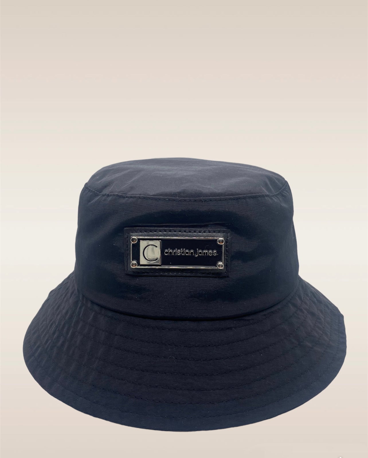 Enhance your style with our sleek and versatile all-black nylon bucket hat. Crafted with high-quality materials, this hat offers a modern twist on a classic design. Perfect for any occasion, its lightweight and durable construction ensures comfort and long-lasting wear. Whether you're heading to the beach, exploring the city, or simply want to elevate your everyday look, our all-black nylon bucket hat is the ultimate accessory for fashion-forward individuals. Shop now and step up your fashion game with this timeless and trendy hat.
