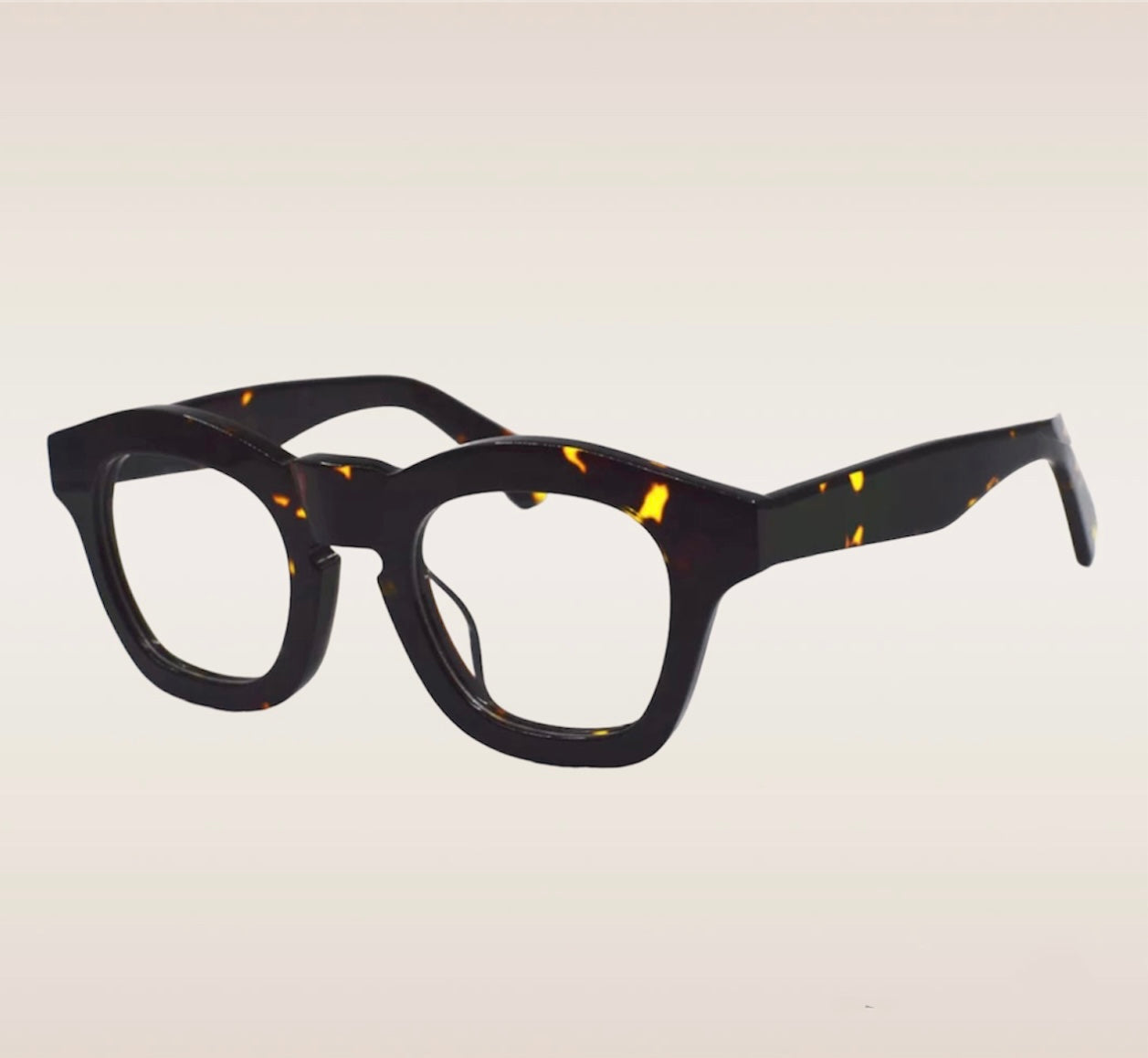 These glasses feature a sleek black frame with eye-catching yellow specs, adding a pop of color to your eyewear collection. With their versatile design and attention-grabbing details, these glasses are sure to make a bold fashion statement.