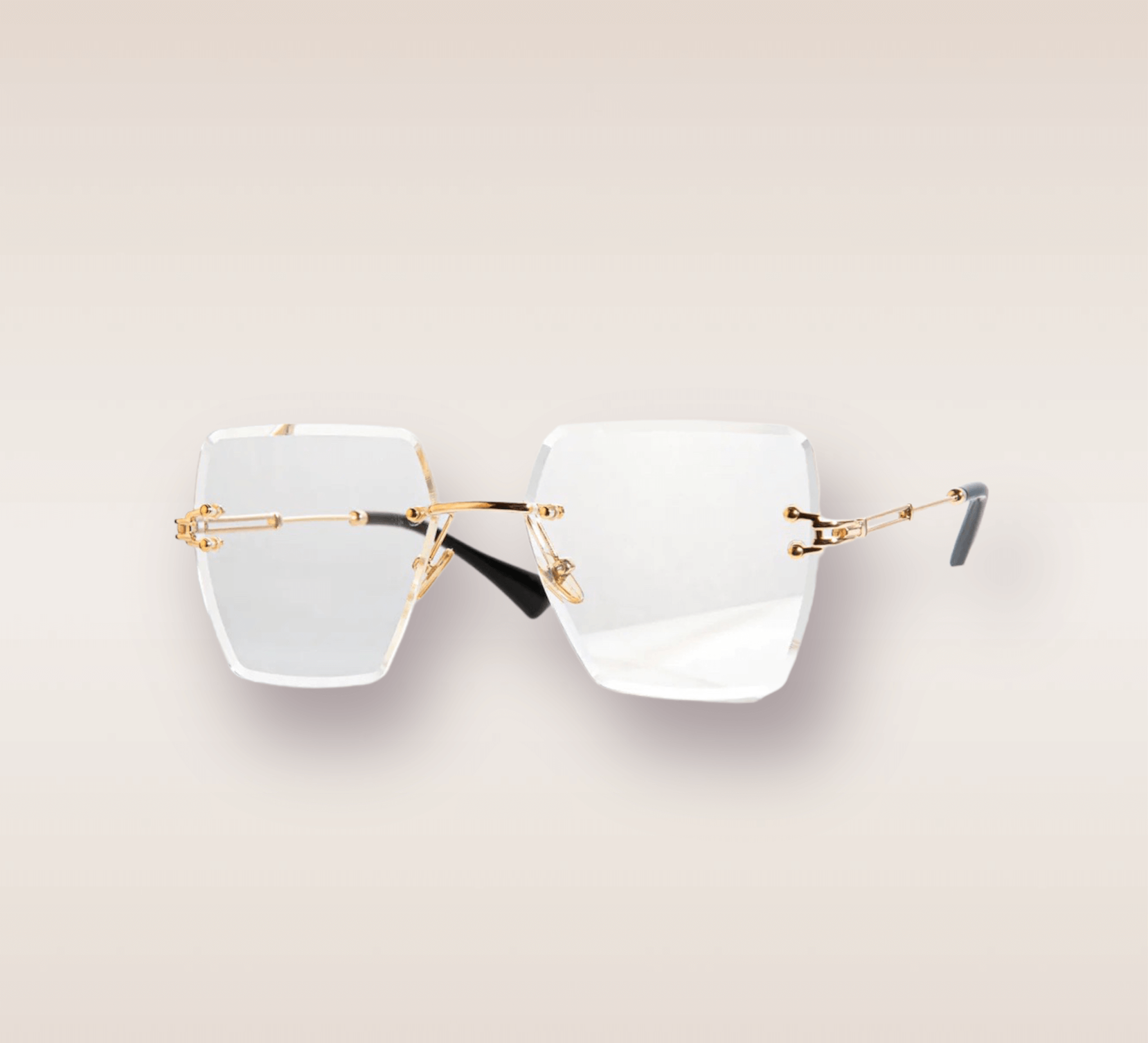 In this up-close shot, we are introduced to the captivating Casper frames, a stylish and sophisticated eyewear option. The rimless frames feature a mesmerizing clear gradient hue. The gold arms add a touch of opulence and refinement, complimenting the clear lens with a warm metallic accent. These frames are a true fashion statement, combining modern design with a touch of luxury. 