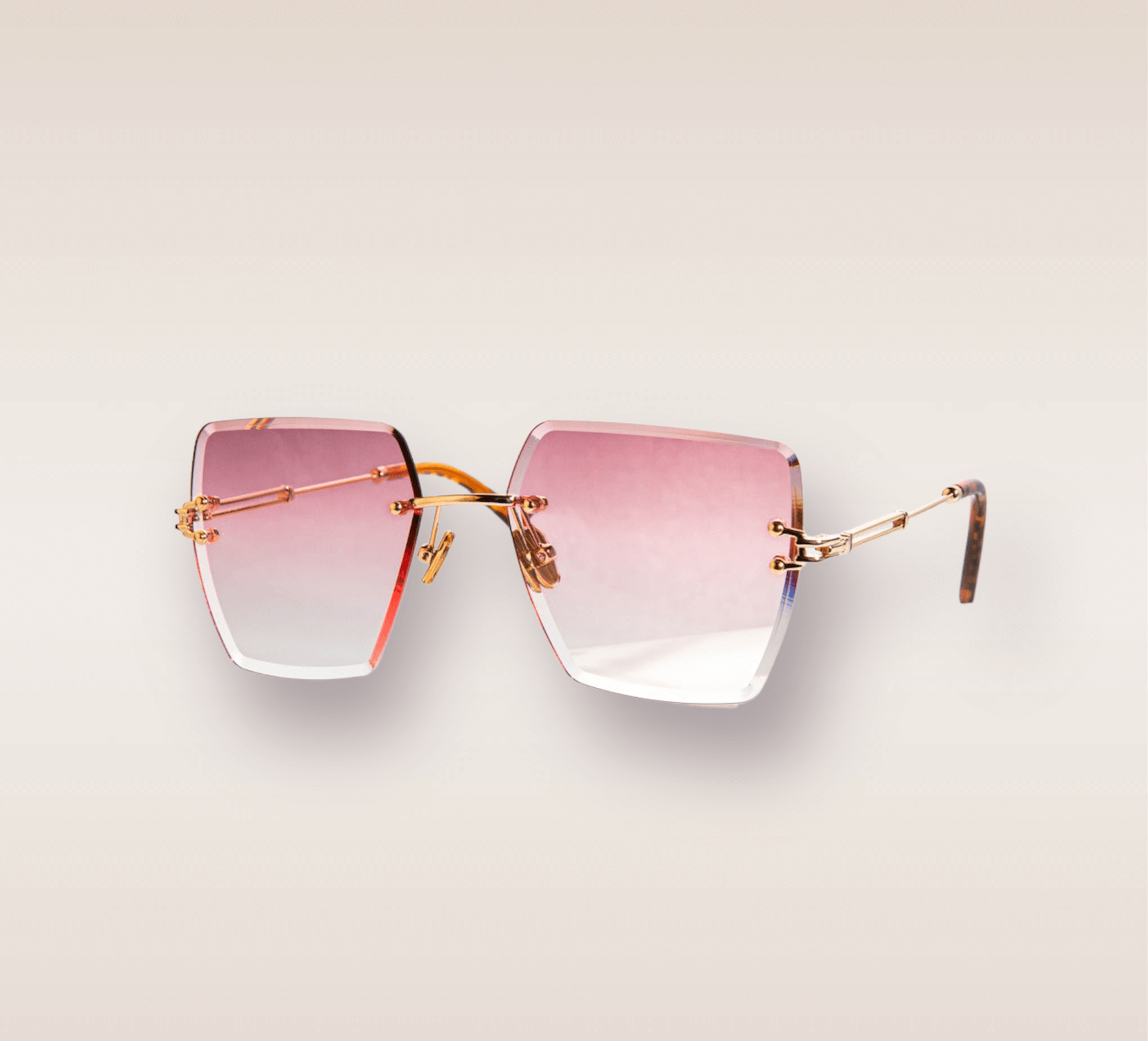 In this up-close shot, we are introduced to the captivating Cranberry Tint frames, a stylish and sophisticated eyewear option. The rimless frames feature a mesmerizing cranberry red gradient hue. The gold arms add a touch of opulence and refinement, complimenting the red tones with a warm metallic accent. These frames are a true fashion statement, combining modern design with a touch of luxury.