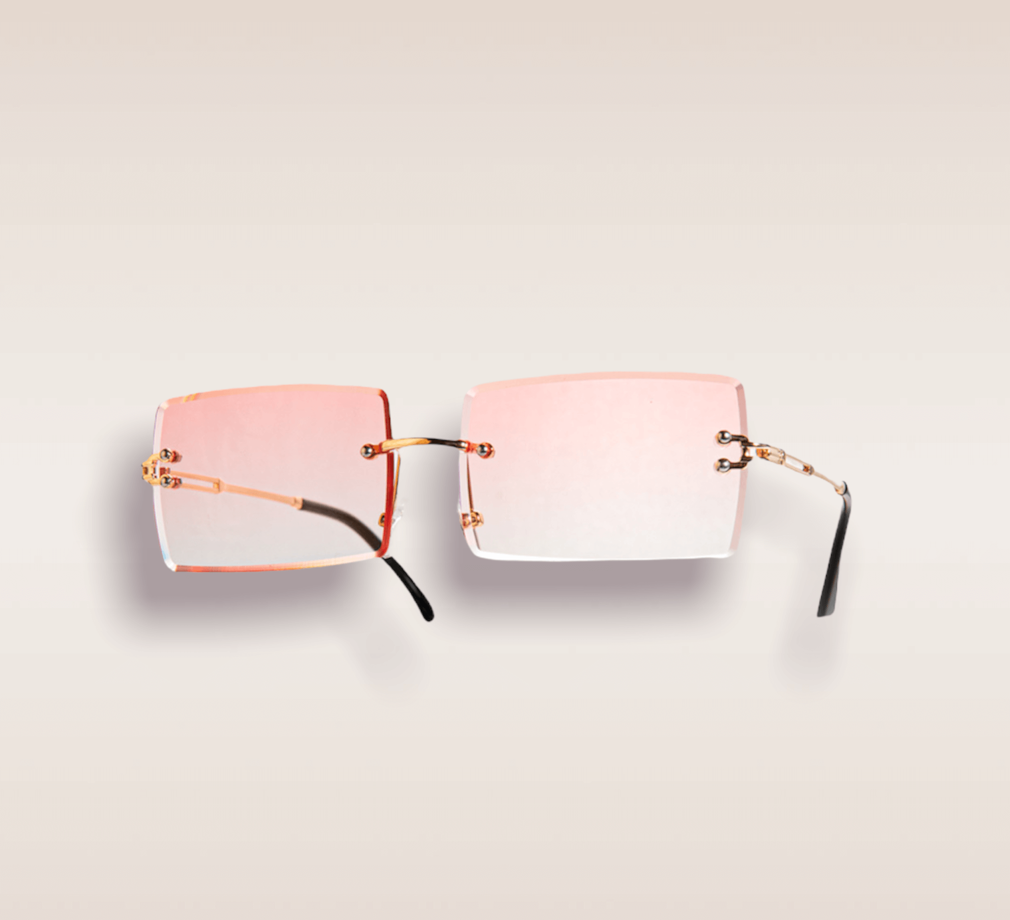 In this up-close shot, we are greeted by a captivating pair of eyeglasses that radiate elegance and personality. The frames boast a delicate combination of pink and gold, intertwining to create a mesmerizing visual spectacle. The soft hue of pink adds a touch of femininity and grace, while the golden accents lend a sense of luxury and sophistication. These frames are a true fashion statement, drawing attention to the eyes with their unique and striking design. The intricate interplay between the pink and gold hues exudes a sense of artistry and individuality, capturing the essence of personal style and self-expression.