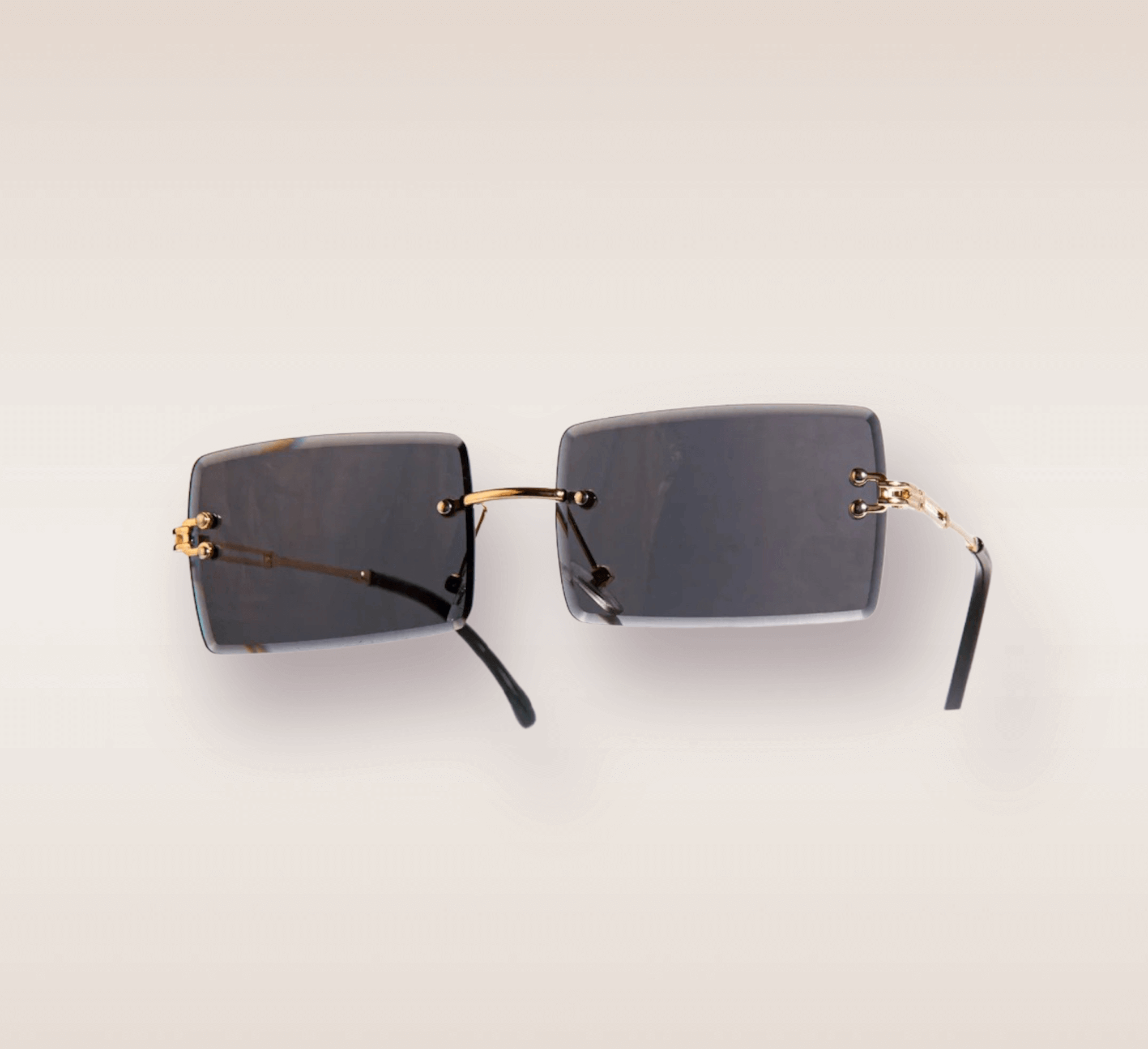 In this up-close shot, we are introduced to the captivating Midnight frames, a stylish and sophisticated eyewear option. The rimless frames feature a mesmerizing black gradient hue. The gold arms add a touch of opulence and refinement, complimenting the black and gray tones with a warm metallic accent. These frames are a true fashion statement, combining modern design with a touch of luxury. 
